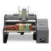 DTM AP360e round bottle label applicator with a hot sauce bottle, front view