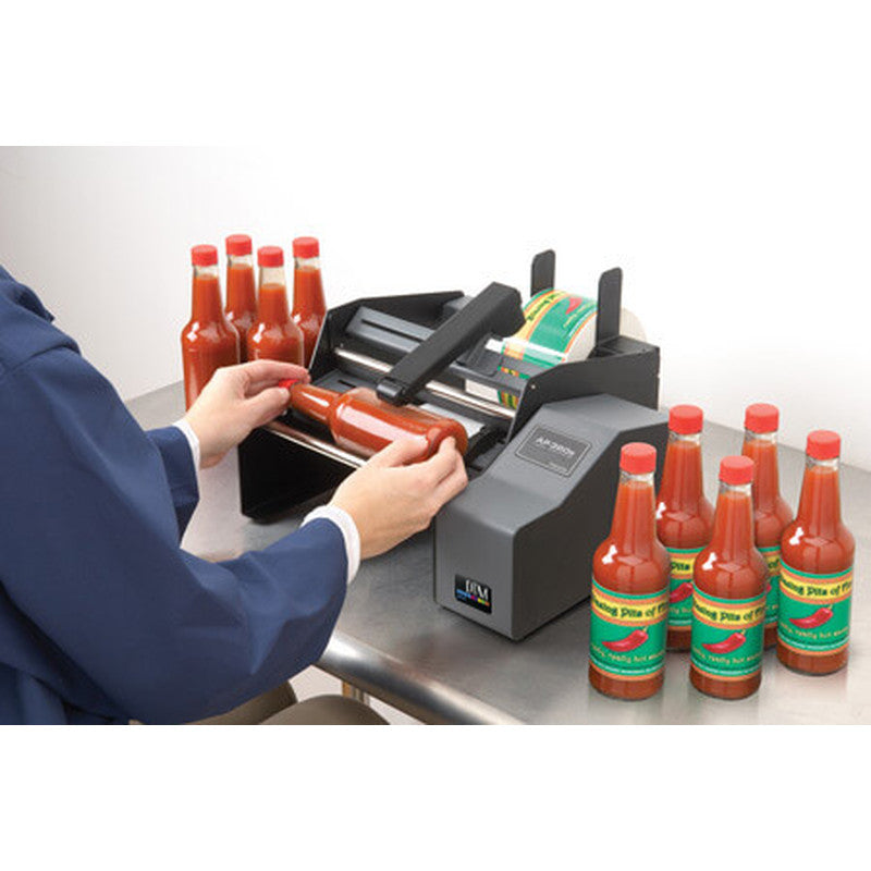 DTM AP360e bottle label applicator in use with sauce bottles