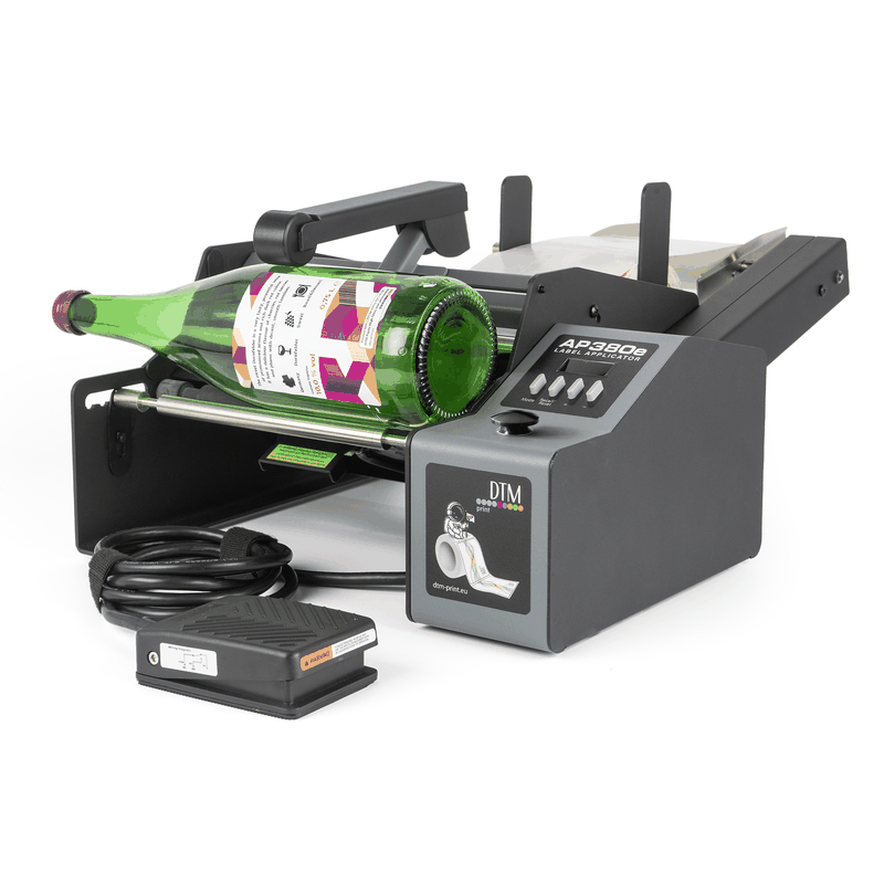 DTM AP380e bottle label applicator with a wine bottle, front left view