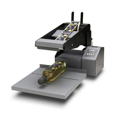 DTM AP550e flat surface label applicator with an oil bottle, front left view