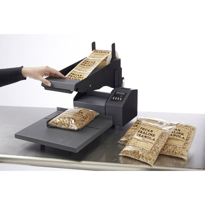 DTM AP550e flat surface label applicator with a pecan container