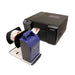 DTM RW-7 label rewinder with a label roll beside an LX2000e printer